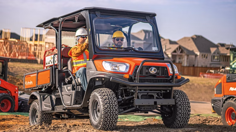 utility rental vehicle being driven by local construction workers